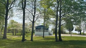 A gazebo-like structure surrounded by trees and grass. - A quiet retreat nestled right in the Hoosier National Forest. (Saint Croix)