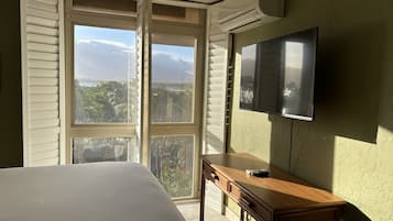 1 bedroom, desk, iron/ironing board, travel crib
