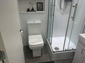 Shower, hair dryer, towels, soap