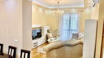 Luxury Apartment | Living area | 52-inch flat-screen TV with cable channels