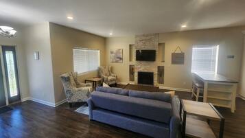 Smart TV, fireplace, table football, books