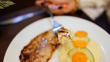 A plate with grilled meat and vegetables.
