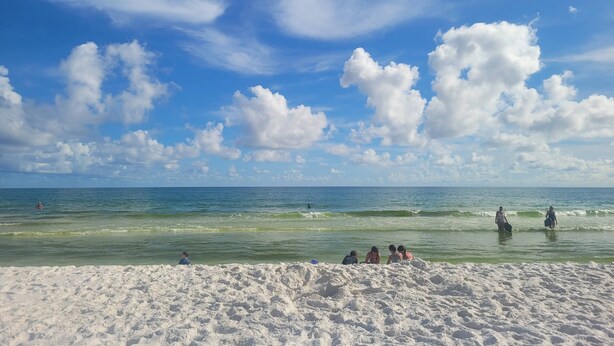 A beach with white sand and a clear blue sky with clouds. - New modern home, 3 minute walk to the beach, on bike trail, full RV hookup (Panacea)
