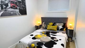 1 bedroom, desk, iron/ironing board, travel crib