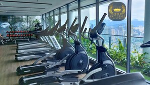 A gym with various cardio machines, a treadmill, and dumbbells. - The Colony Skyline Suites KLCC (Kuala Lumpur)