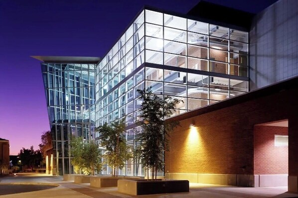 Contemporary building with a geometric design and glass facade.