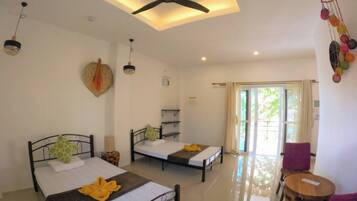 Deluxe Garden and Pool View | Desk, laptop workspace, blackout drapes, soundproofing