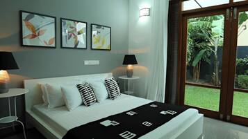 Apartamento junior, 1 habitación, no fumadores, vistas al jardín | 1 dormitorio, sábanas de algodón egipcio, ropa de cama de alta calidad