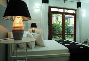 Junior-Apartment, 1 Schlafzimmer, Nichtraucher, Gartenblick | Bettwäsche aus ägyptischer Baumwolle, hochwertige Bettwaren