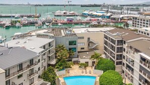A marina with boats, a swimming pool, and modern buildings. - The Vibe: Auckland CBD
 (Auckland)