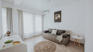 Apartamento | Área de estar | TV de tela plana