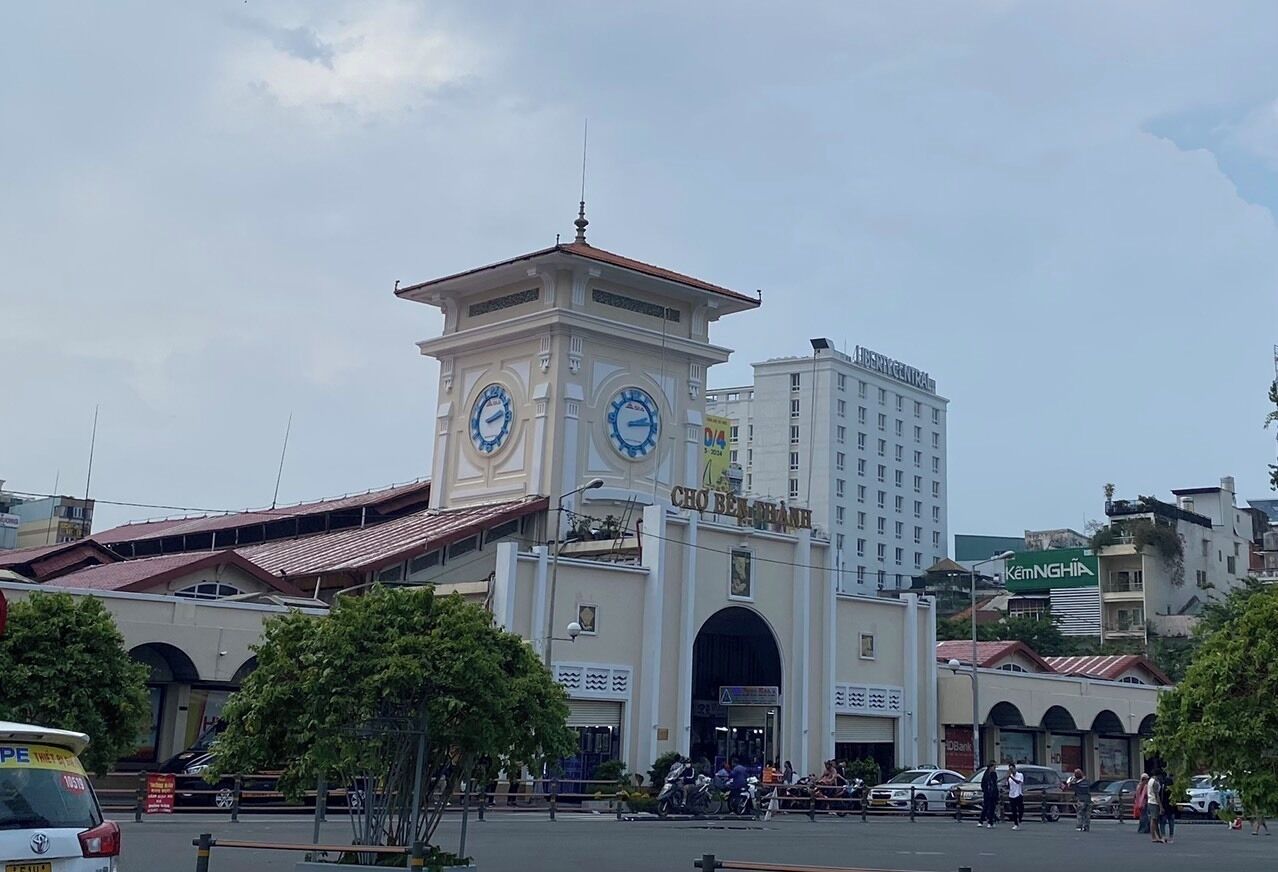 A building with a clock tower and a large archway.
