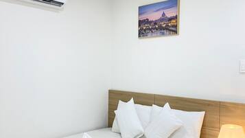 Exclusive Triple Room, City View | Minibar, in-room safe, individually decorated, individually furnished