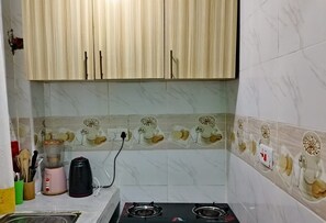 Microwave, stovetop, cookware/dishes/utensils, spices