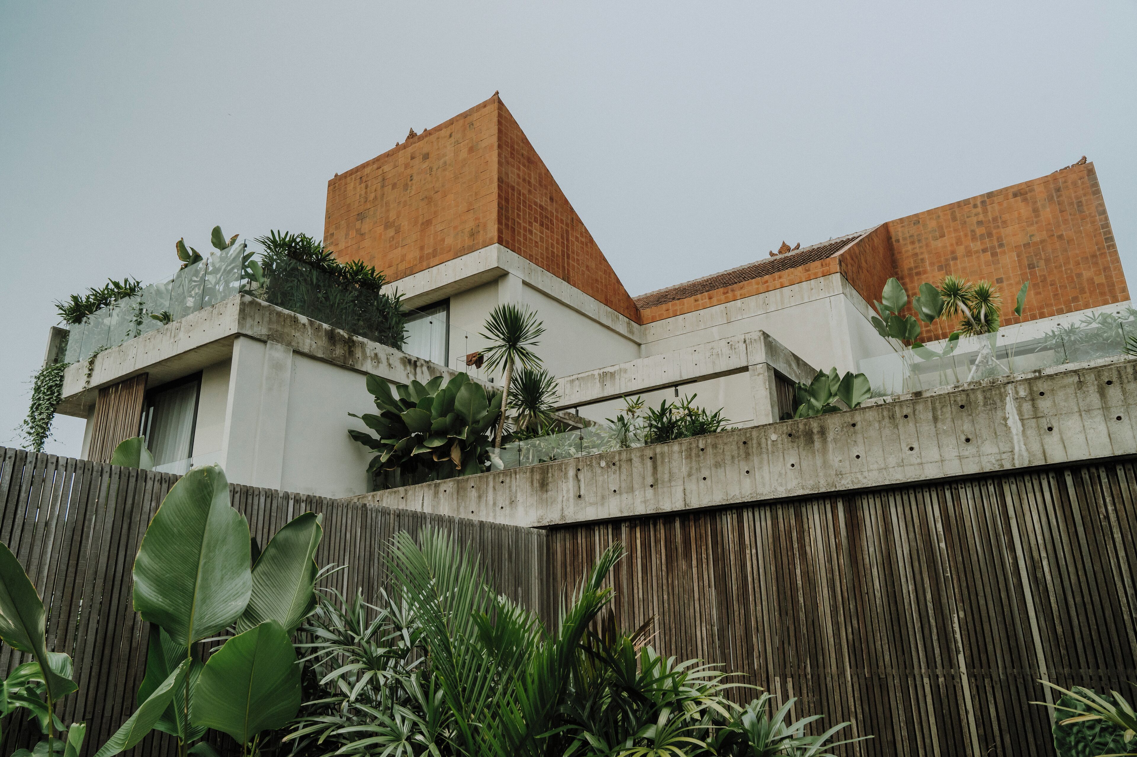 A modern building with a triangular roof and a concrete facade.