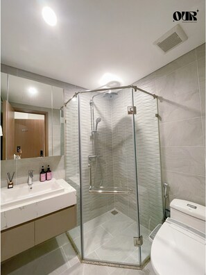 Shower, hair dryer, towels, soap