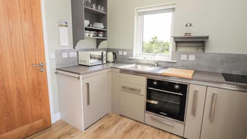 Fridge, electric kettle, toaster, cookware/dishes/utensils