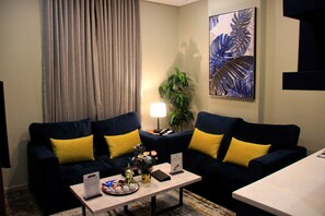 50-inch flat-screen TV with satellite channels - Swat Serviced Apartments 4 (Al Khobar)