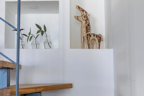 A staircase with a wooden handrail and a white wall. - PORT CITY HAIFA - BAT GALIM LUXURY (Haifa)