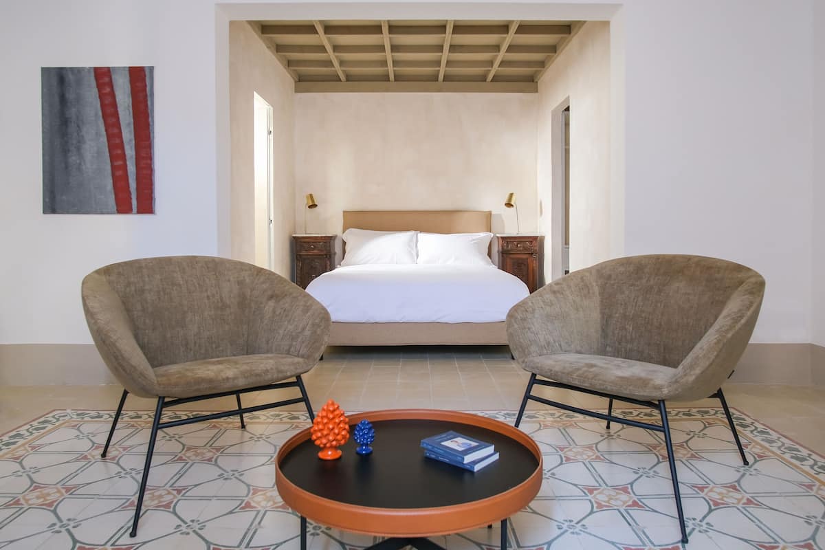 Junior Suite | 1 bedroom, in-room safe, blackout curtains, free WiFi