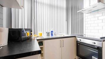 Apartment | Private kitchen | Fridge, microwave, oven, stovetop