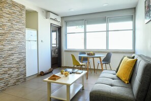 Apartment | Living area | 40-inch flat-screen TV with cable channels - Simple Living in Netanya by Sea N' Rent (Netanya)
