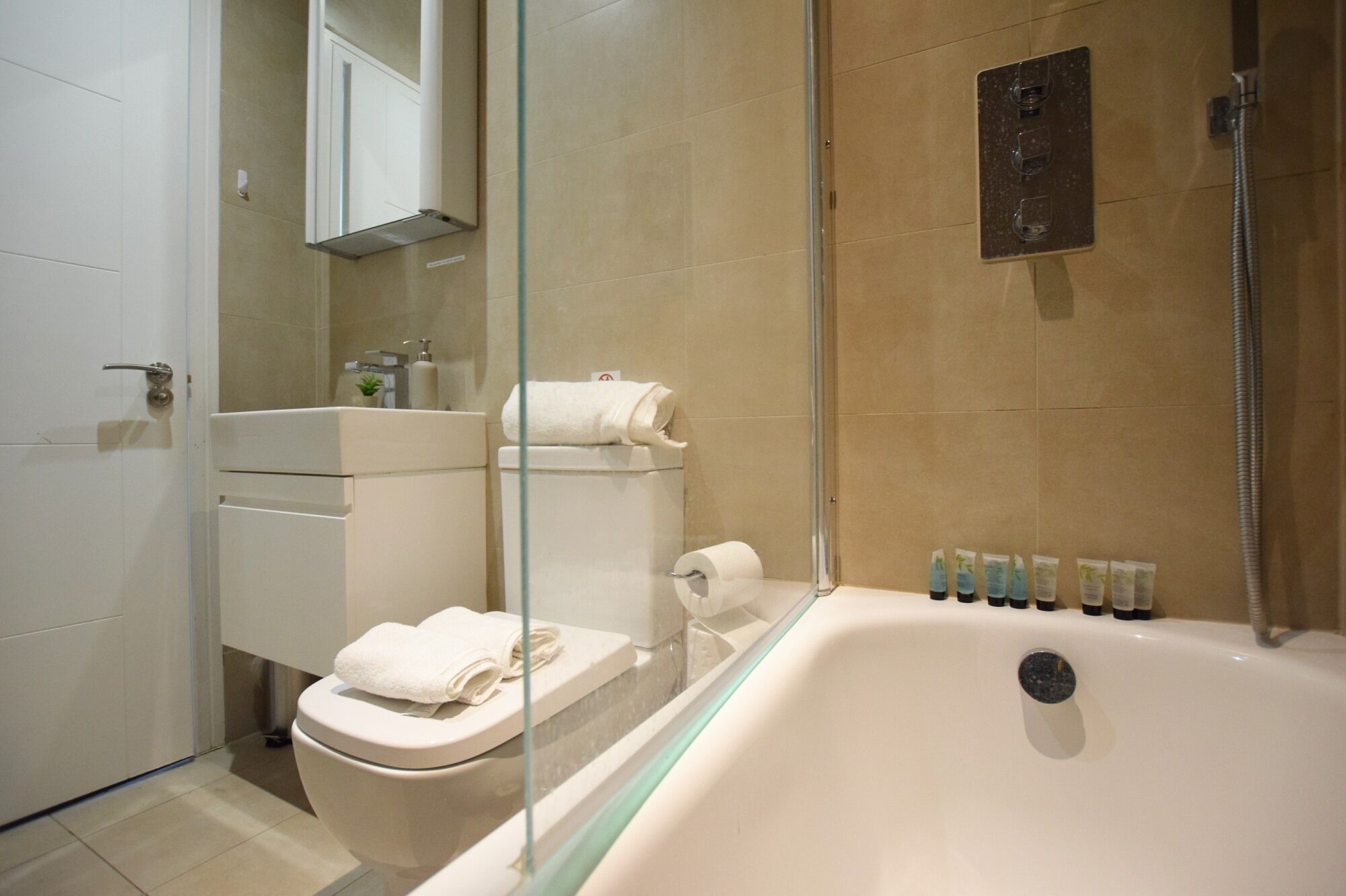 Apartment, 1 Queen Bed | Bathroom | Combined shower/tub, deep soaking tub, hair dryer, towels