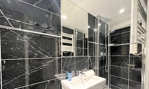 Shower, hair dryer, towels