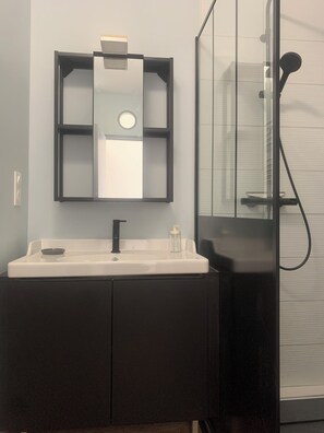 Shower, hair dryer, towels, soap