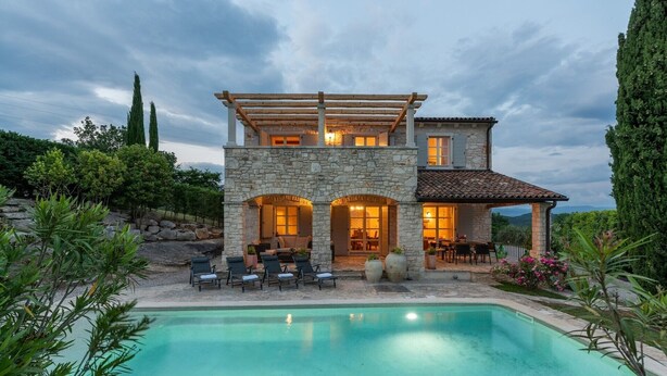 A two-story stone house with a covered patio and a swimming pool. - Beautiful Villa Habibi with pool (Sovinjak)