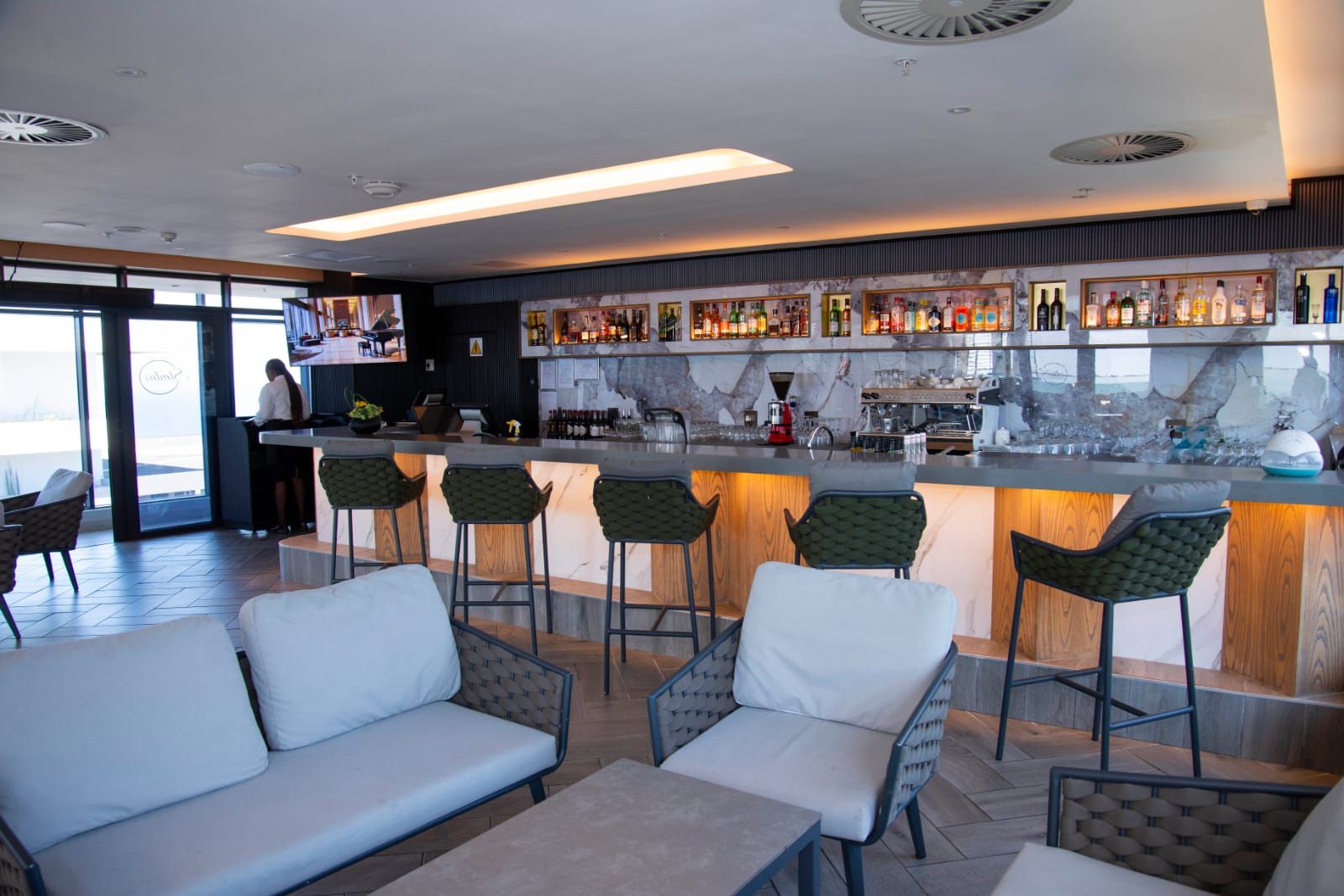 A bar area with seating and a bar counter.