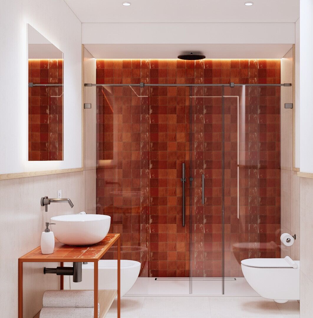 Un baño moderno con ducha de vidrio, lavamanos blanco y retrete.