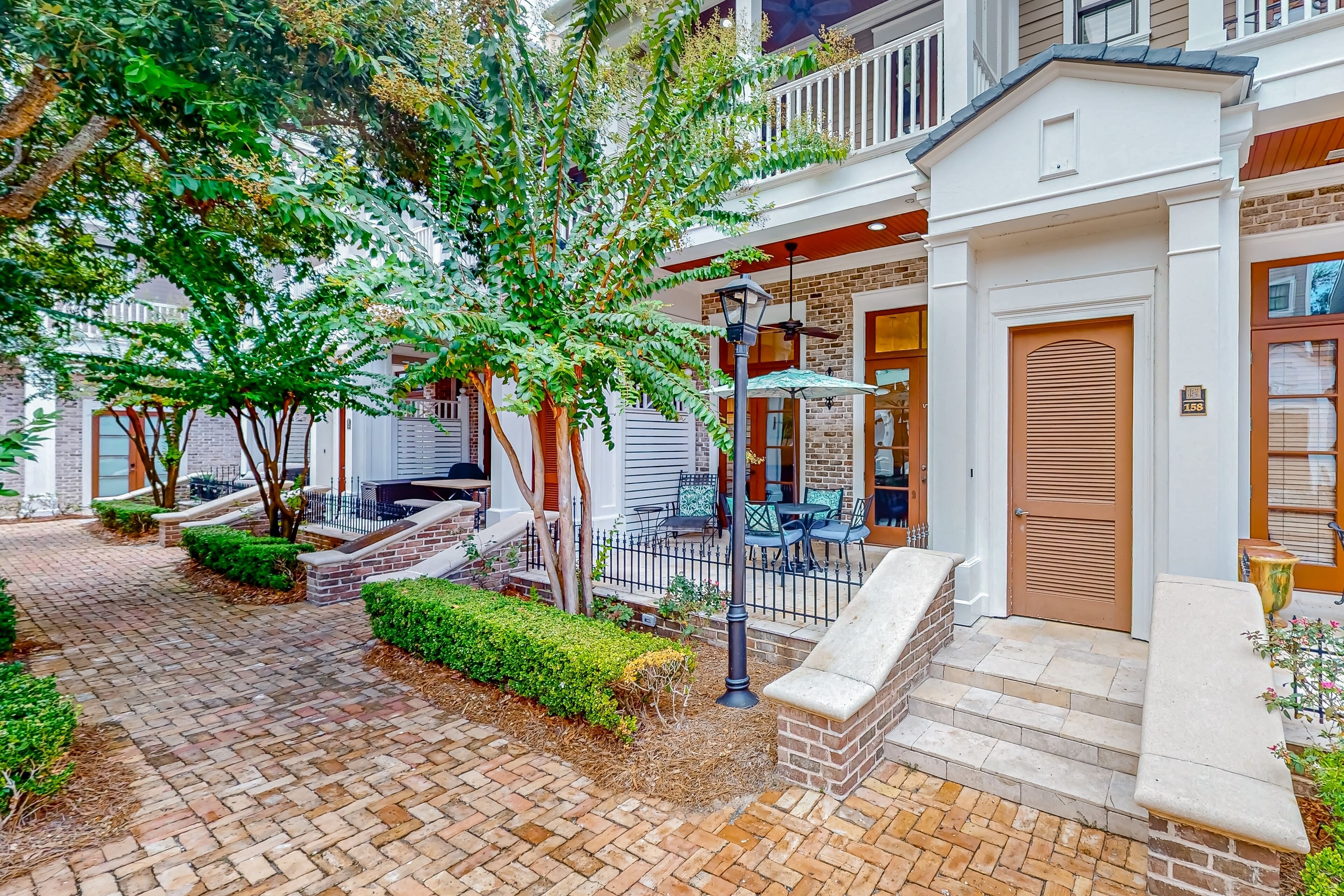 Fountain-view townhome with outdoor areas, shared pool, & hot tub