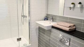 Hair dryer, towels, soap, toilet paper