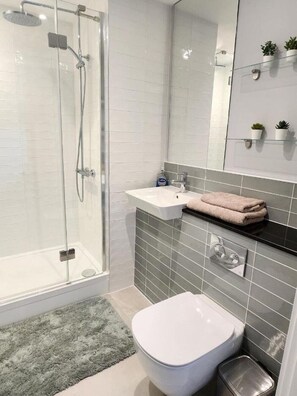 Combined shower/tub, hair dryer, towels, soap