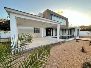 A modern two-story house with a covered patio and a swimming pool. - Tush villa is a new, spacious, modern, cheerful (Calodyne,)