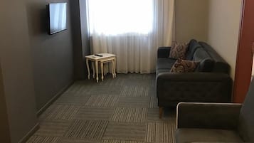 Elite Condo, 1 Queen Bed with Sofa bed, Smoking, City View | Living area | 82-inch Smart TV with satellite channels, Netflix, streaming services