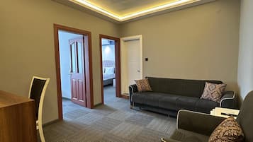 Habitación cuádruple familiar | Ropa de cama de alta calidad y minibar