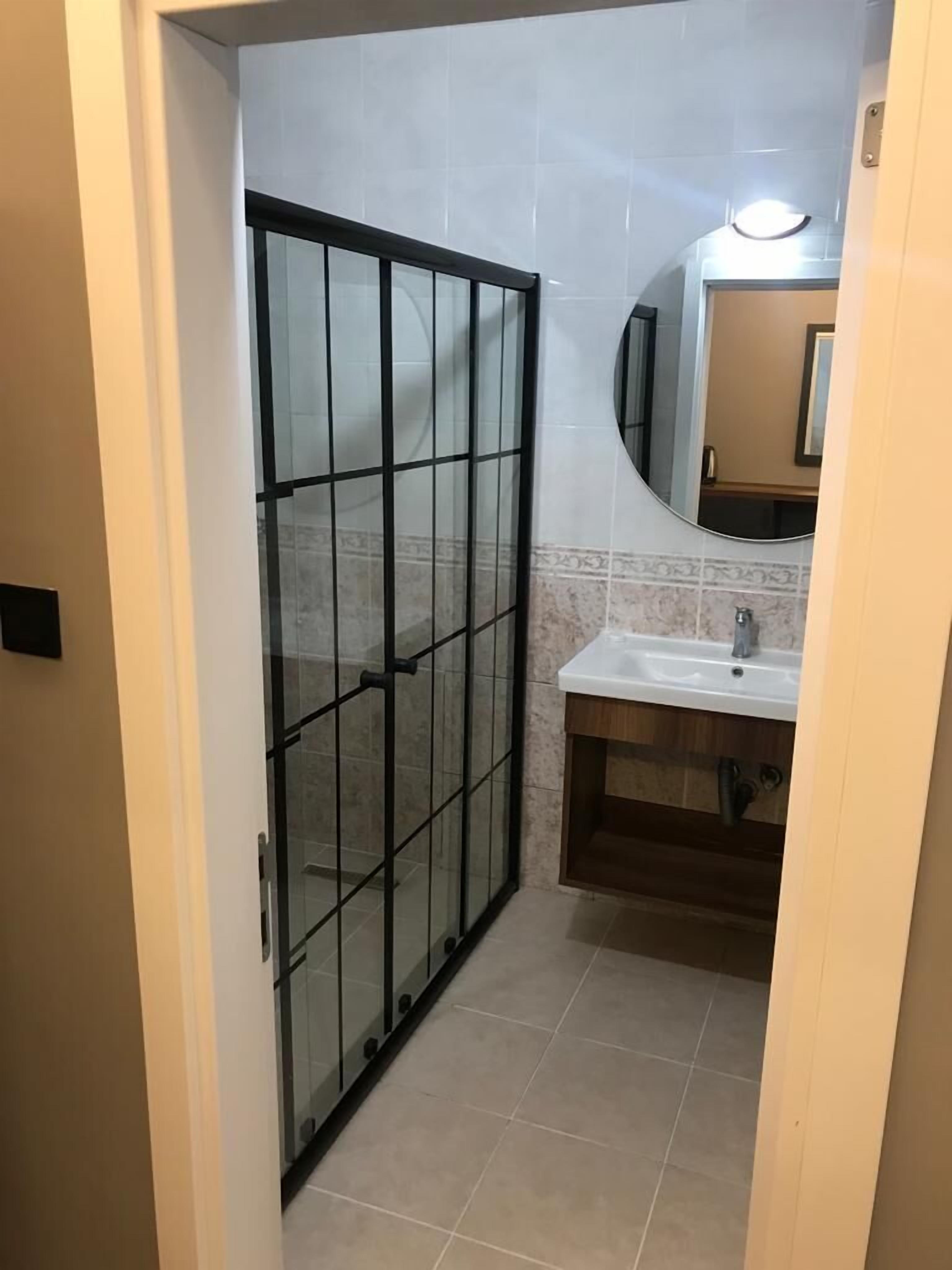 Elite Condo, 1 Queen Bed with Sofa bed, Smoking, City View | Bathroom | Shower, rainfall showerhead, hair dryer, slippers