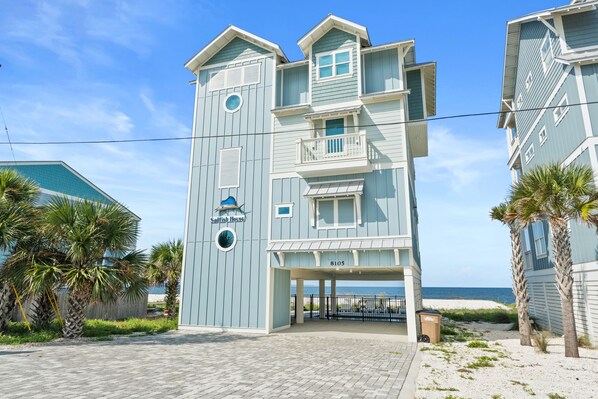 A multi-story building with a sign reading "Sailfish House" and the number 8105. - Beach House - Sailfish by PHG (Port St. Joe)