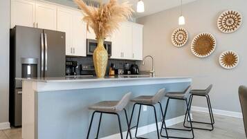 Coffee/tea maker, fridge, microwave, oven