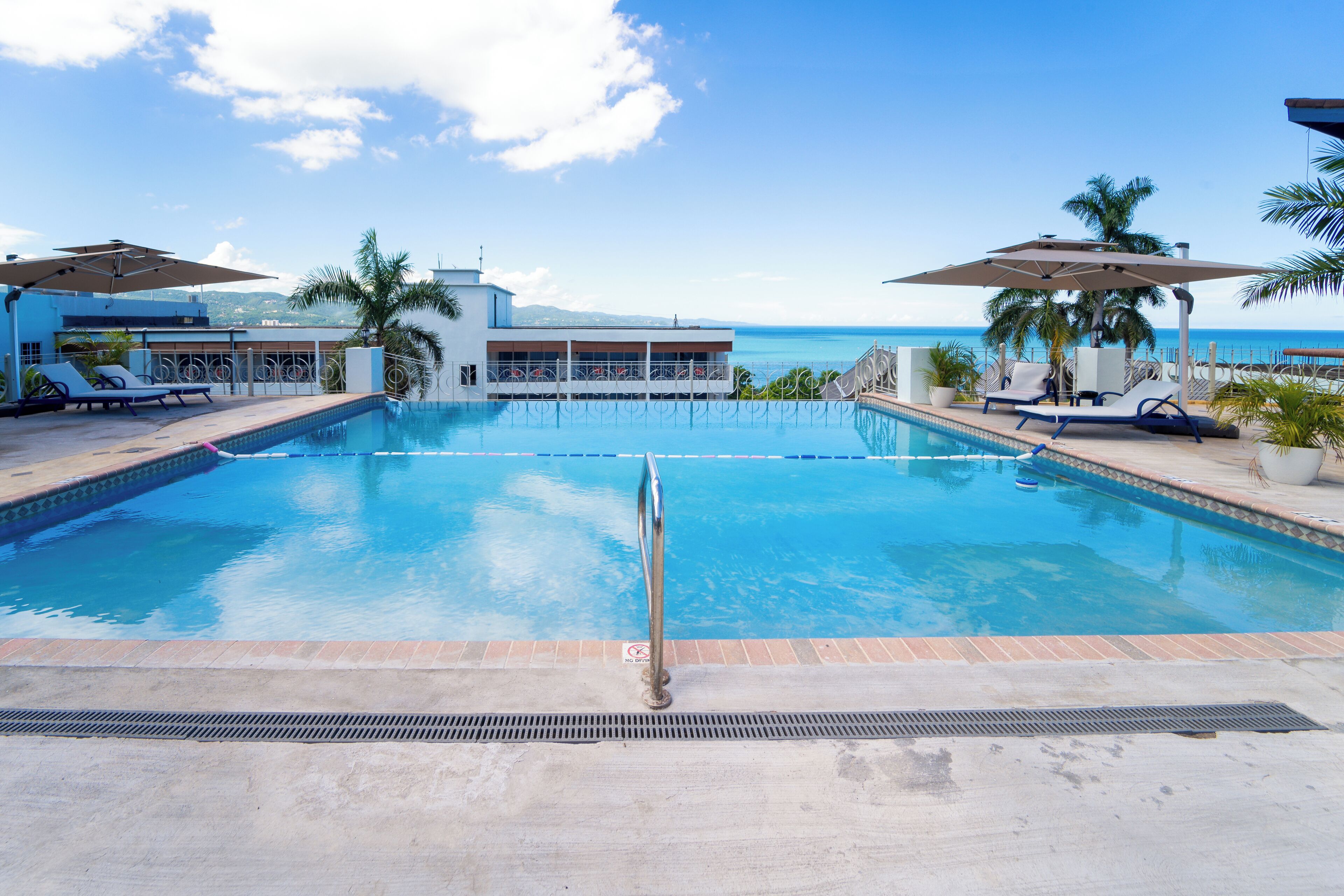 Outdoor pool, open 6:00 AM to 7:00 PM, pool umbrellas, sun loungers