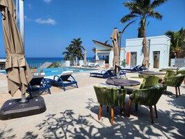 Outdoor pool, open 6:00 AM to 7:00 PM, pool umbrellas, sun loungers