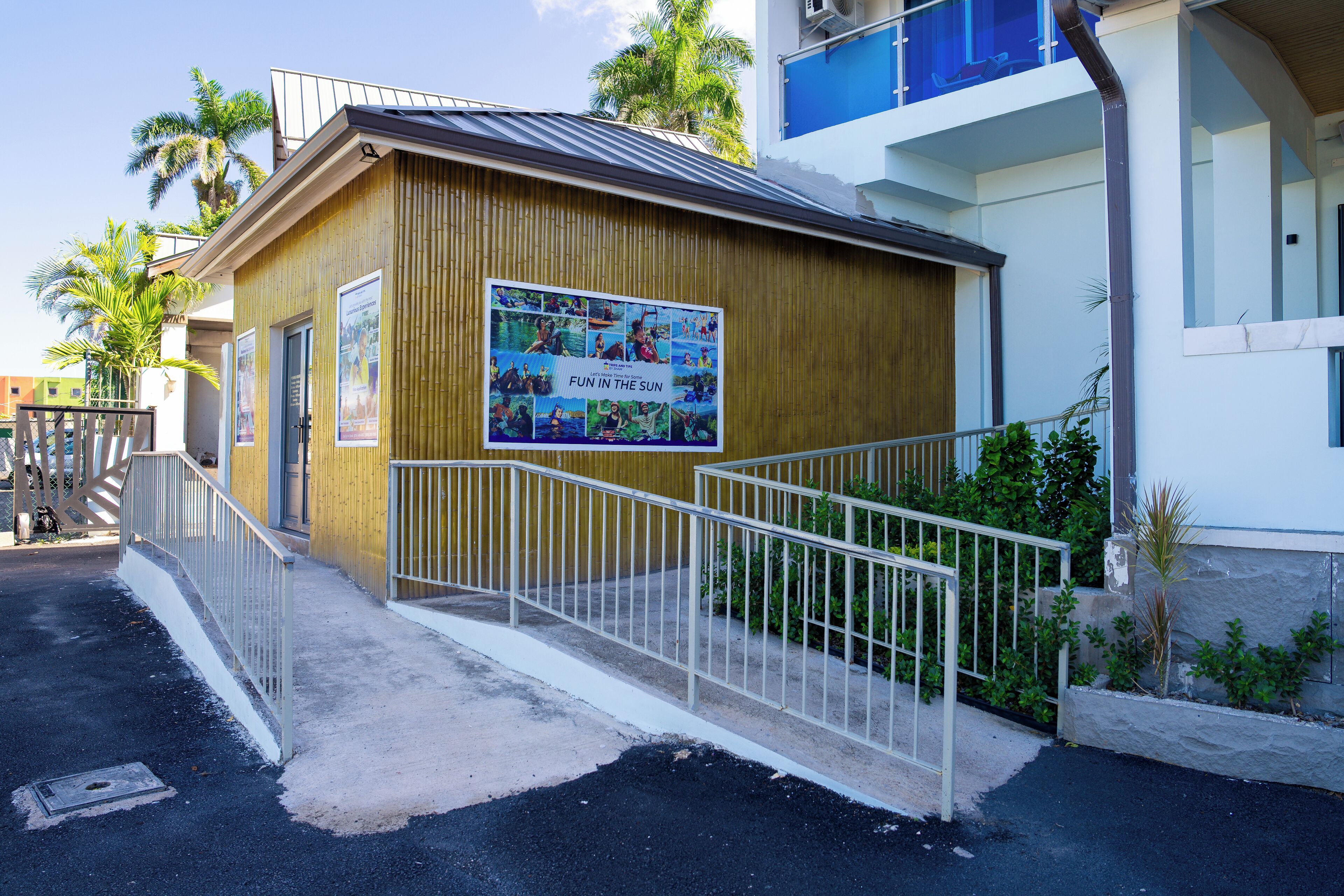 A small wooden building with a poster advertising a fun in the sun event.