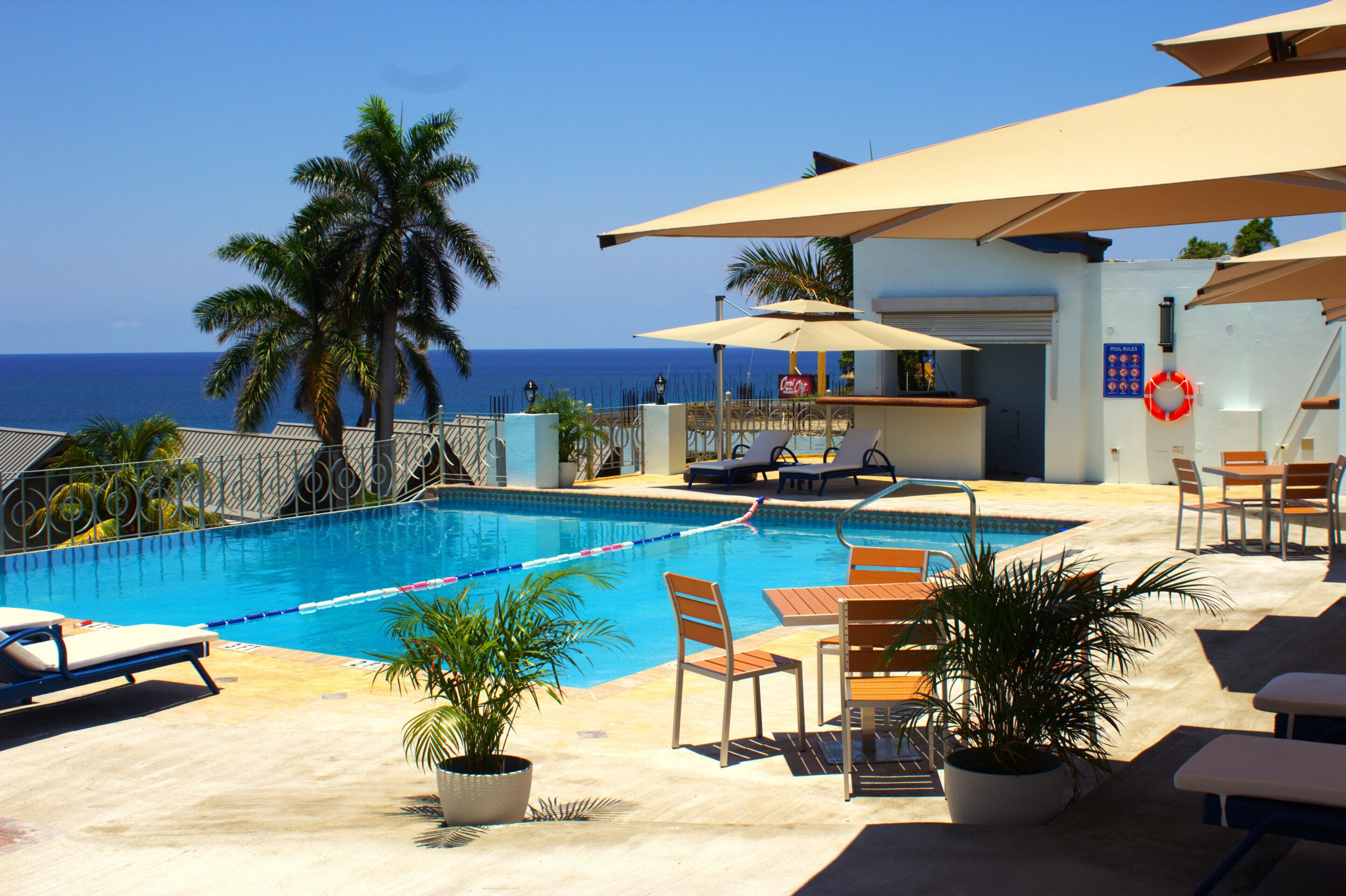 Outdoor pool, open 6:00 AM to 7:00 PM, pool umbrellas, sun loungers