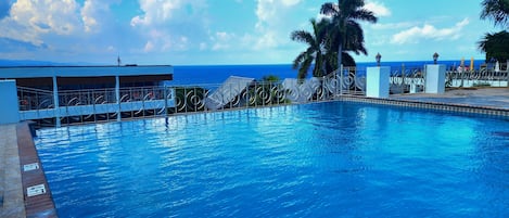 Outdoor pool, open 6:00 AM to 7:00 PM, pool umbrellas, sun loungers
