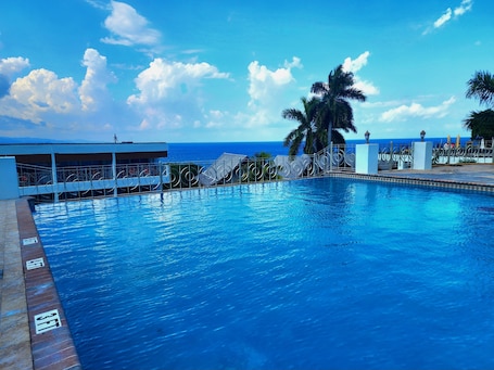 Outdoor pool, open 6:00 AM to 7:00 PM, pool umbrellas, sun loungers