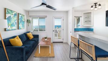 Condo, 1 Queen Bed with Sofa bed, Balcony, Ocean View (Unit 4) | Living area | 40-inch flat-screen TV with cable channels, TV