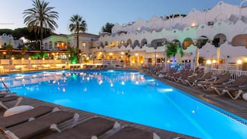 Relax by the resort's pool surrounded by a unique wavy design.