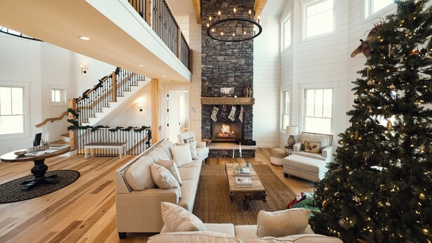 A spacious living room with a fireplace, a staircase, and a Christmas tree. - Ann Riley Farmhouse Yuba Vineyards (Williamsburg)